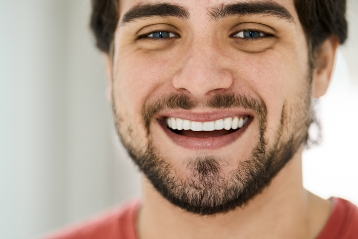 middle-aged man with restored white teeth